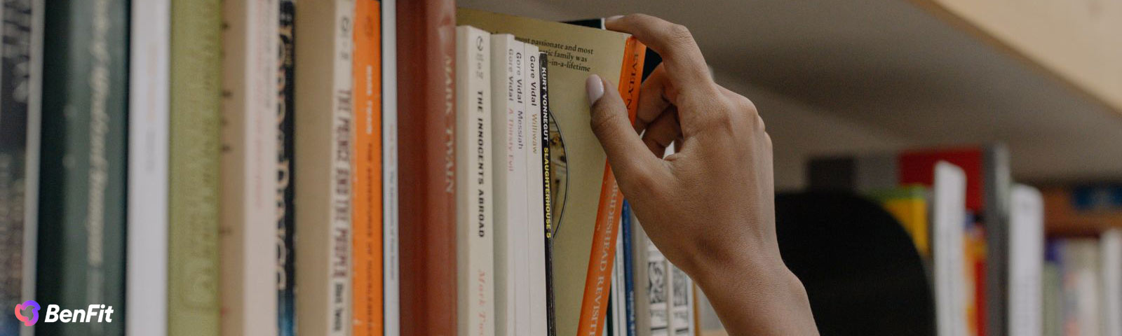 Stack of uplifting self-help books titled to boost your mood, mindset and well-being