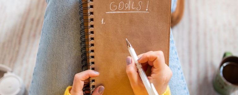 Fresh start concept with notebook, pen and healthy lifestyle elements symbolizing new year opportunities